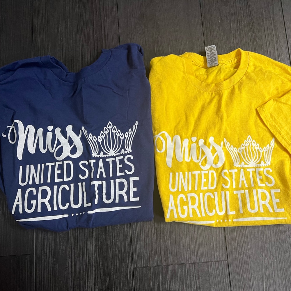 2 good condition Miss US Agriculture t-shirts. Navy - size M, Yellow- size S.